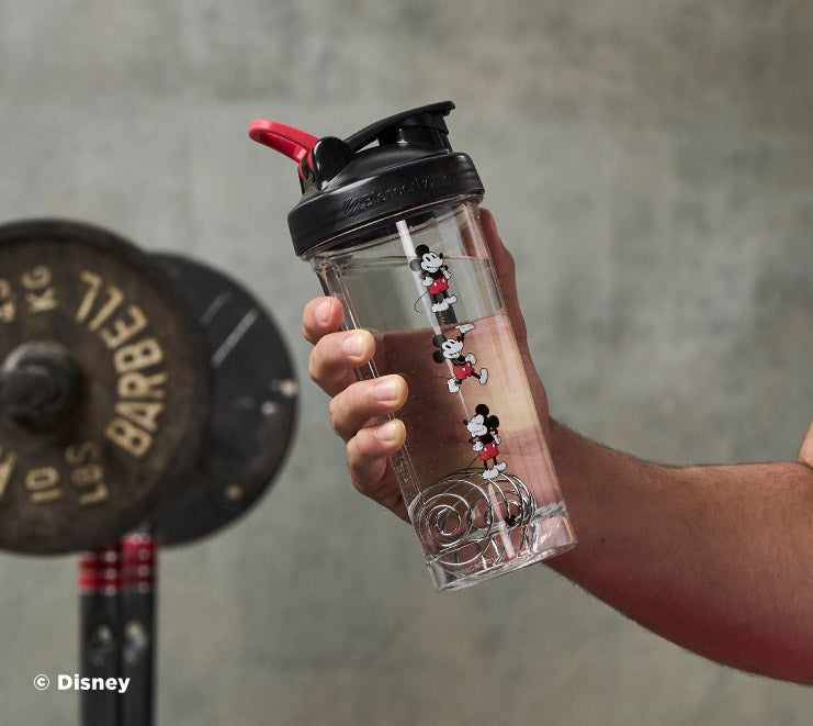 pro-series-h7 Mickey_Mouse_Protein_Shaker_Bottle_Being_Held_In_the_Gym.jpg